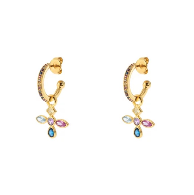 A close-up of gold cross hoop earrings featuring a cross charm adorned with sparkling multicolored cubic zirconia stones.