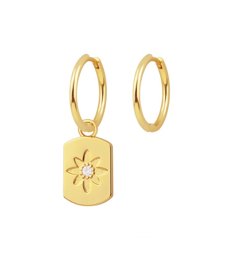 Gold-plated Star Huggie Earrings featuring a delicate charm with a central white cubic zirconia stone.
