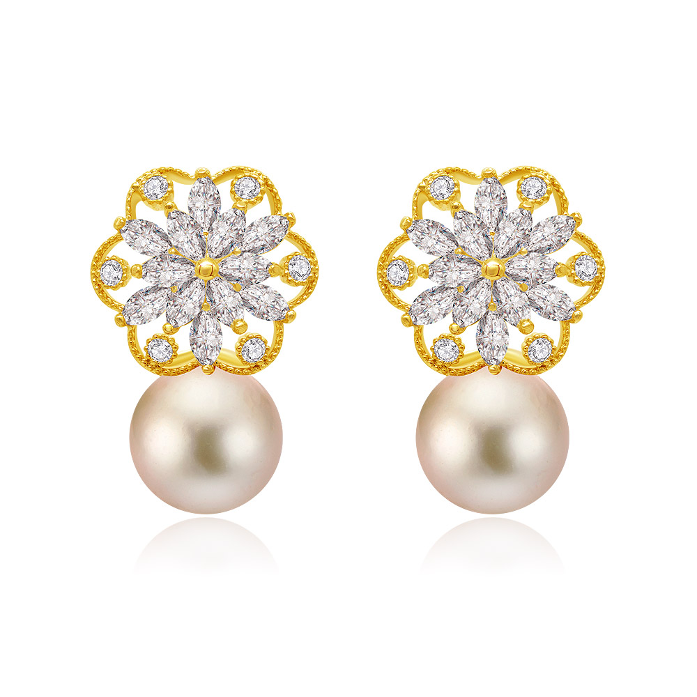 Dangle With Delight Pearl Studs featuring gold-toned metal flower tops with clear gemstones and large light-colored pearls.