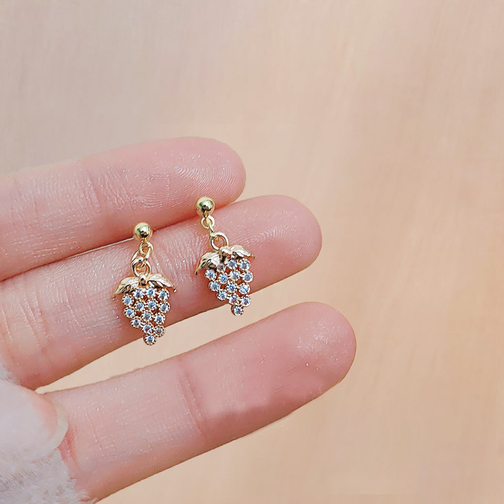 A pair of gold-plated drop earrings designed as a bunch of grapes, intricately detailed with sparkling tiny zircons.