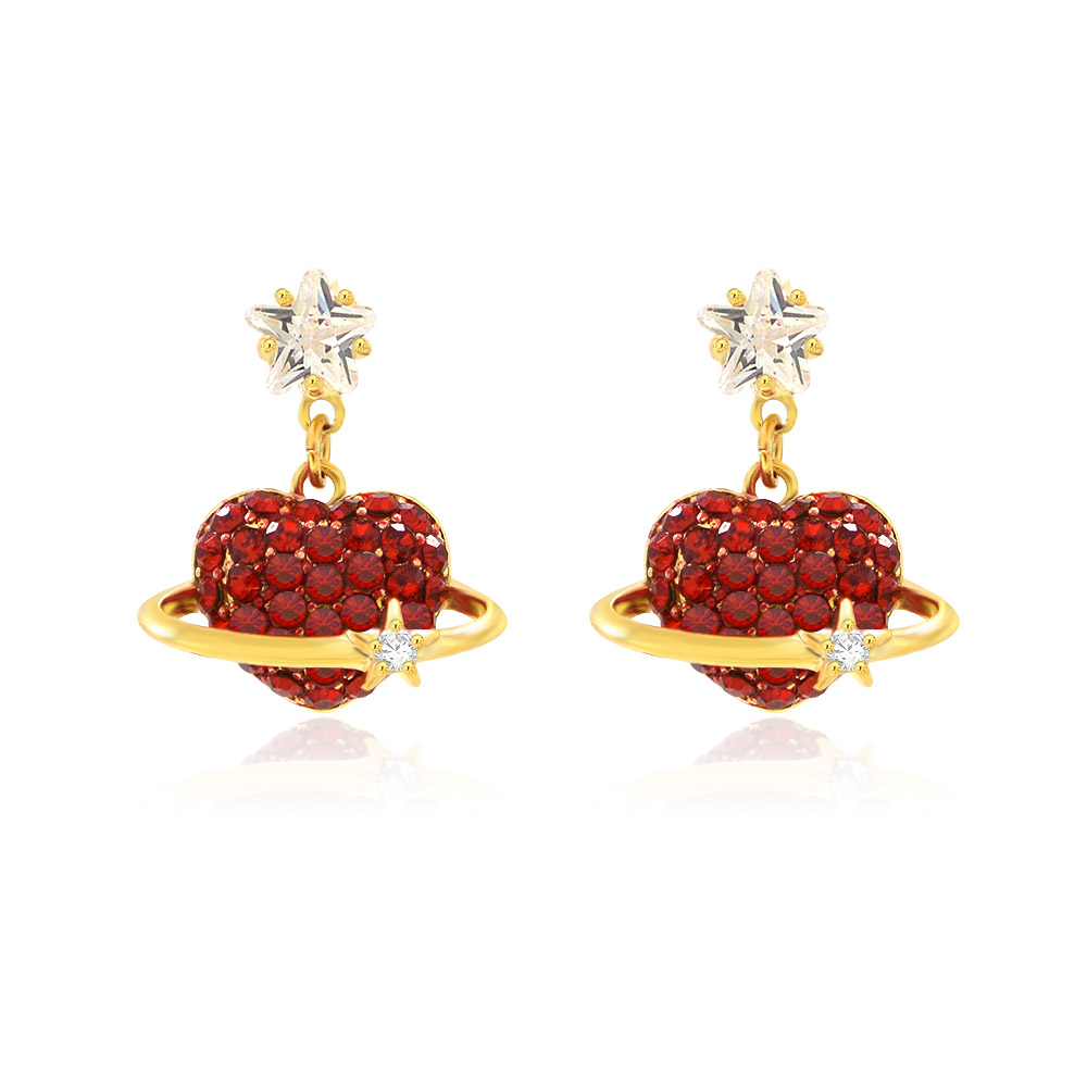 A pair of gold heart-shaped earrings featuring vibrant red crystal pavé, accented with a clear cubic zirconia stone and a star-shaped stud.