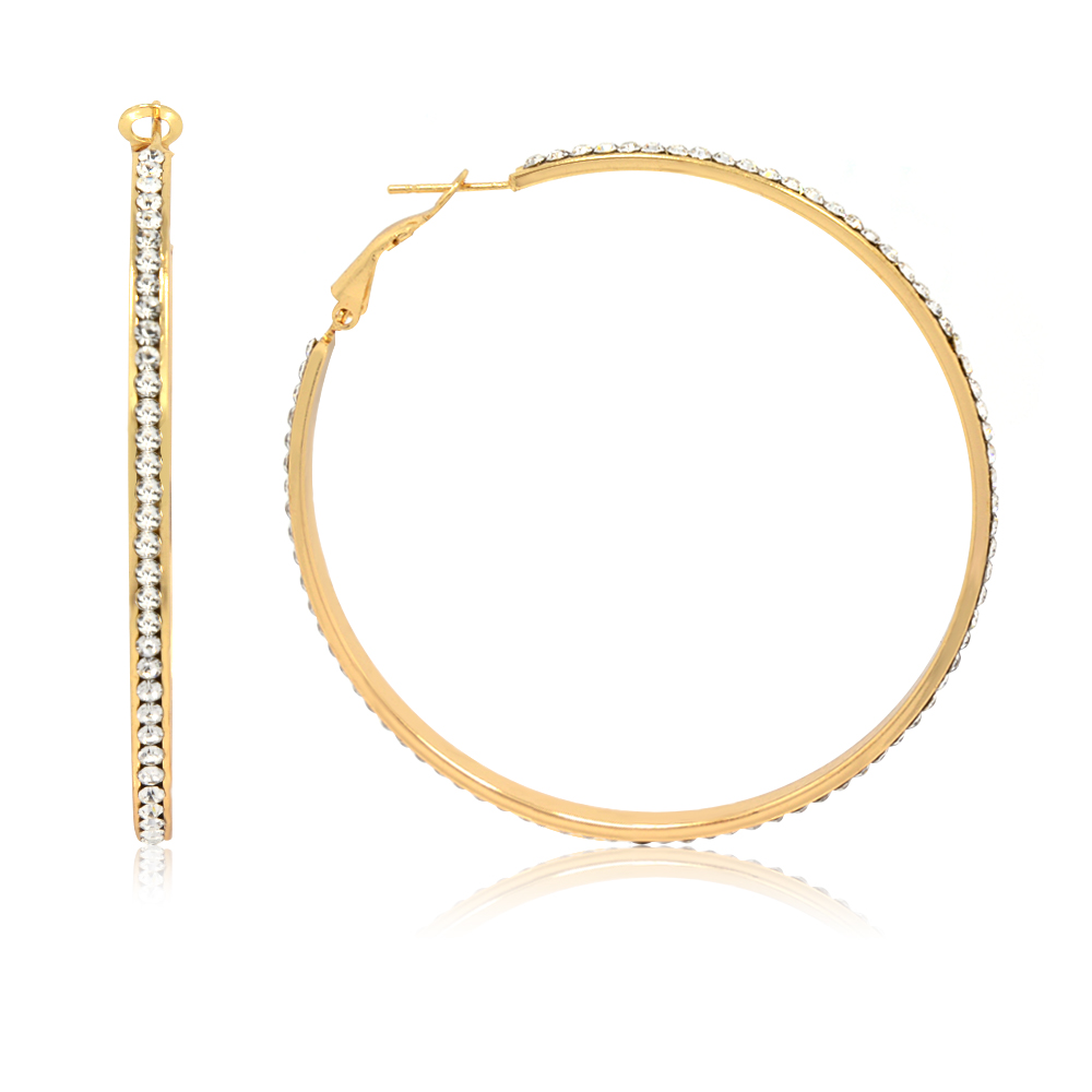 A close-up view of a large gold-plated hoop earring, highlighting the intricate row of white Czech rhinestones.