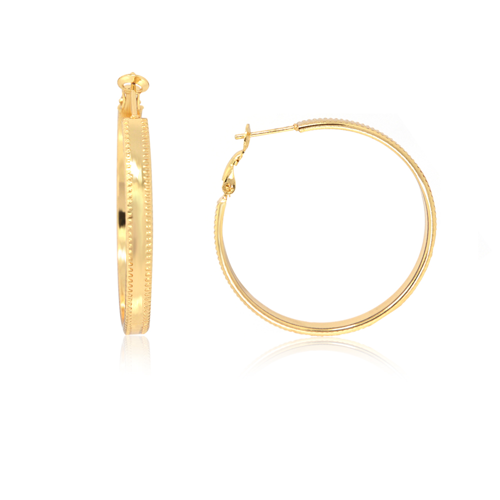 A close-up of the Medium Gold Hoop Texture Earrings, showcasing the detailed textured pattern on the gold-plated surface against a white background.