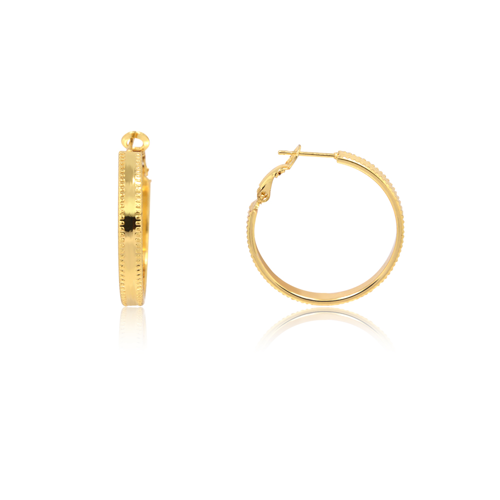A close-up of the 30mm gold-plated diamond-cut round hoop earrings, showcasing the textured dot pattern on the edges.