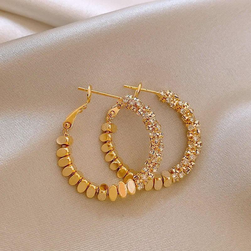 A collection of 14K gold-plated simple metal stitching round hoop earrings with various textures, showcasing the 5-pair set.