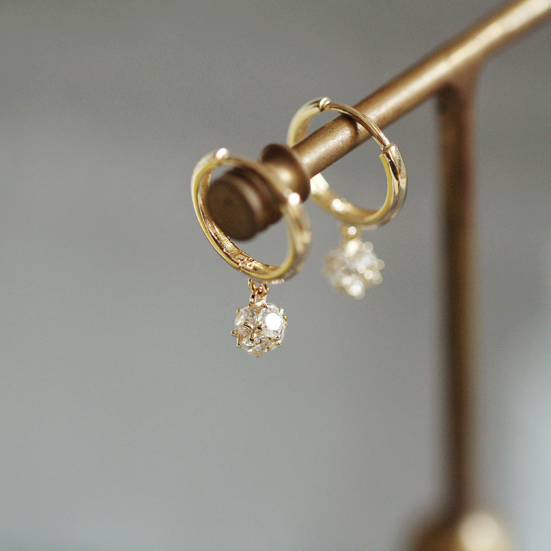 A pair of 925 sterling silver gold-plated hoop earrings with clear, dainty zircon gemstones, part of a five-pair set.