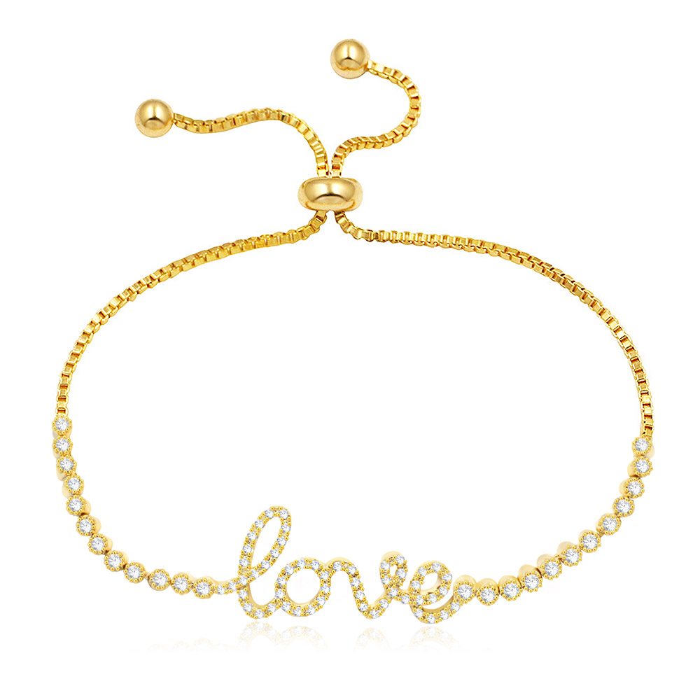 Close-up of the Love Letter Adjustable Cubic Zircon Bracelet in gold, showcasing the sparkling 'love' script charm.