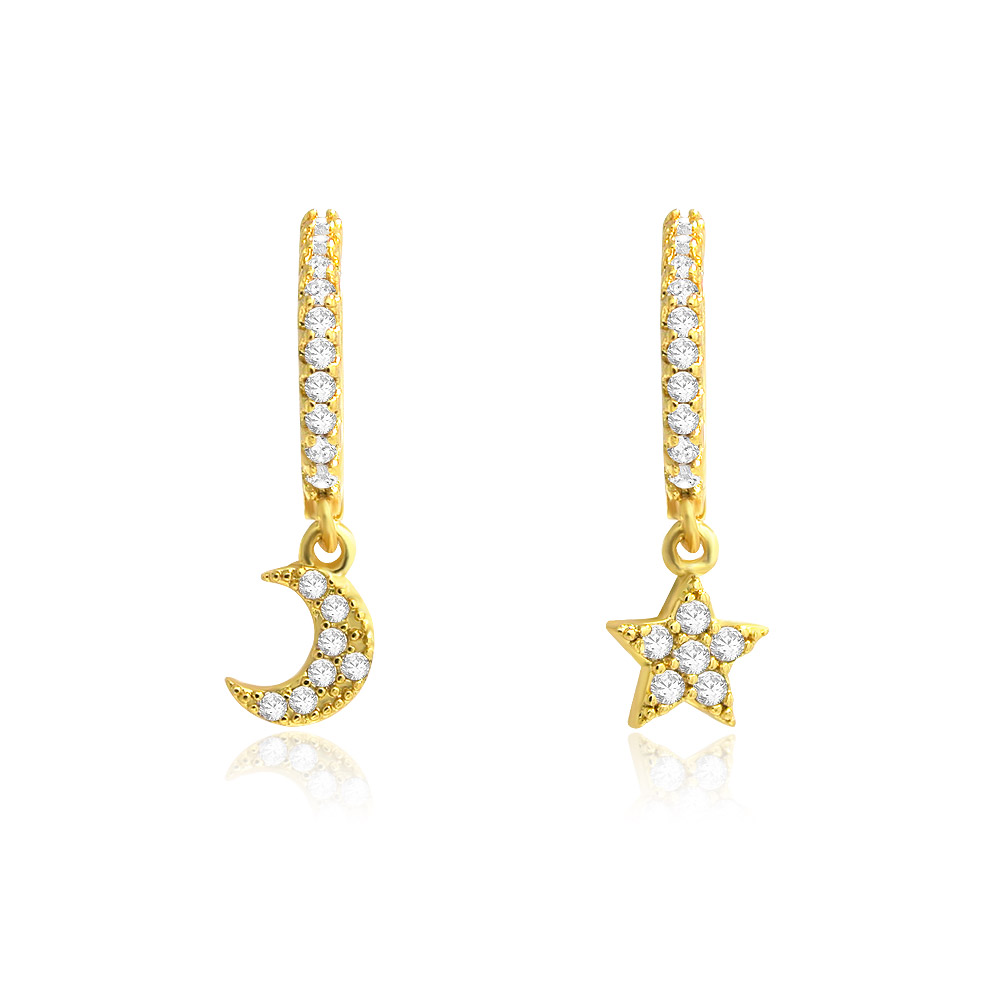 A detailed studio shot of the gold-plated Moon and Star Huggie Earrings, showcasing the intricate cubic zirconia stones on the celestial charms.