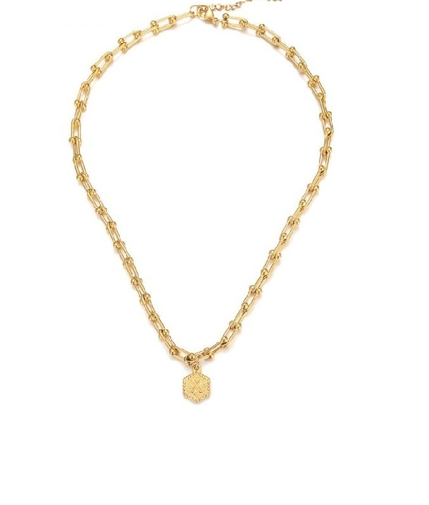 A stylish personalized alphabet initial letter necklace in gold plating, featuring a modern hexagonal pendant on a delicate chain.