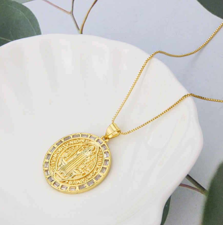 Custom gold religious faith necklace featuring a detailed winged pendant, an example of custom jewelry by JR Fashion Accessories.