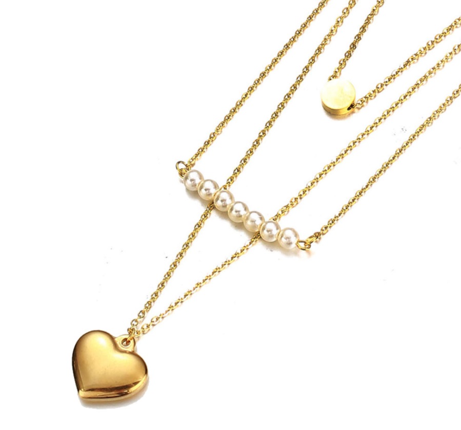 A stylish stainless steel layered necklace with a gold-plated finish, featuring elegant pearl, heart, and disc pendants.