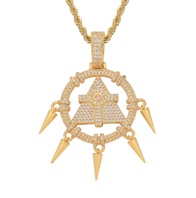 A close-up of the Custom Millennium Wheel Wisdom Necklace in a gold finish, featuring a detailed triangular pendant with spikes and encrusted with cubic zirconia stones.