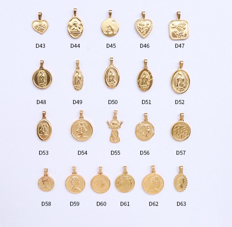 A diverse collection of custom gold religious pendants with various symbolic designs, manufactured by JR Fashion Accessories.