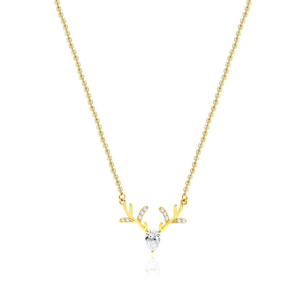 Close-up of the Gold Deer Necklace, showcasing the reindeer-shaped pendant with a large teardrop cubic zirconia and smaller stones on the antlers.
