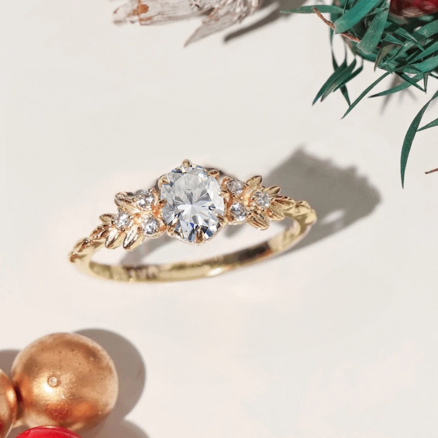 Close-up of the Olive Branch Rhinestone Ring in 925 sterling silver with gold plating, featuring a brilliant central oval zircon and delicate olive branch details.
