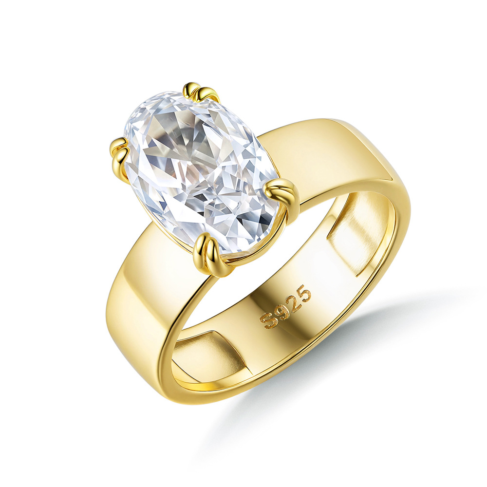 A close-up of a gold-plated S925 sterling silver ring with a large oval cubic zirconia, representing the quality of JR Fashion's clip-on CZ earrings.