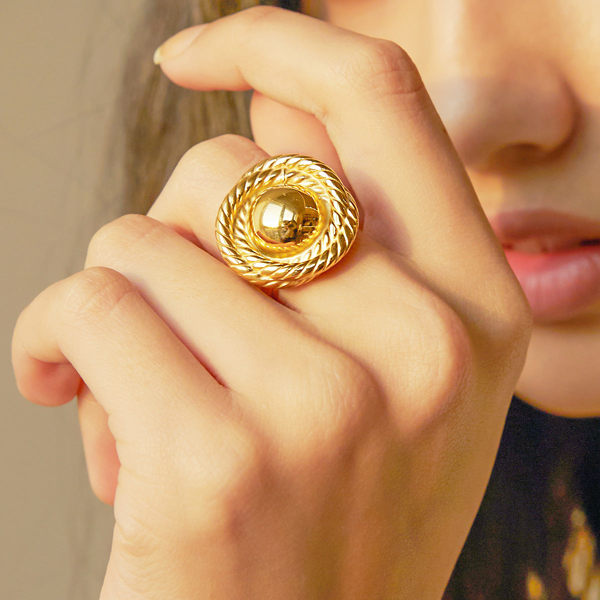 Close-up of a stainless steel gold rope textured open ring from the set of five, showcasing its intricate design and polished finish.