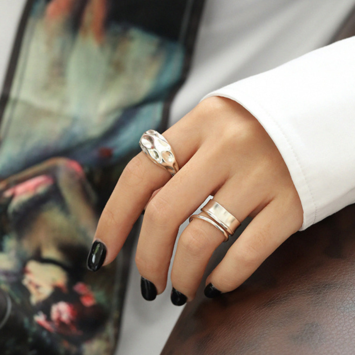 A woman's hand elegantly wearing the double-band 925 sterling silver rings, showcasing the minimalist Korean-style design.