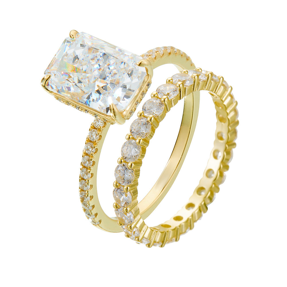 Taylor Swift inspired 2-piece bridal set in gold-plated 925 sterling silver, featuring a cushion cut CZ engagement ring and a matching eternity band.