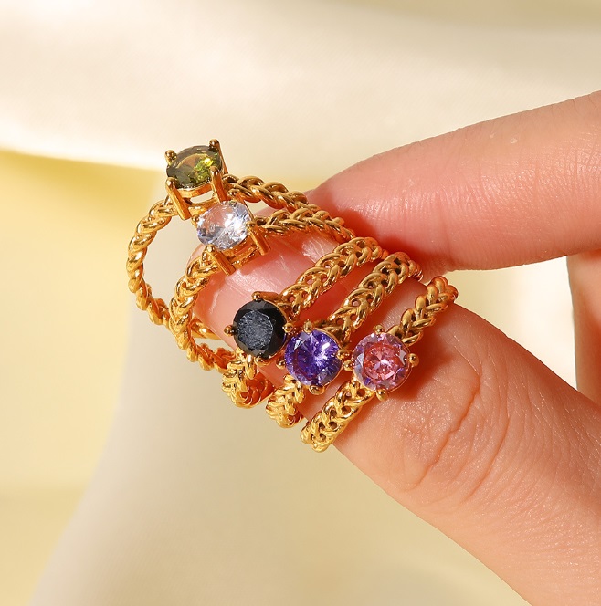 A collection of gold-plated wholesale rings with vibrant colored gemstones by JR Fashion Accessories, model JRR-026.