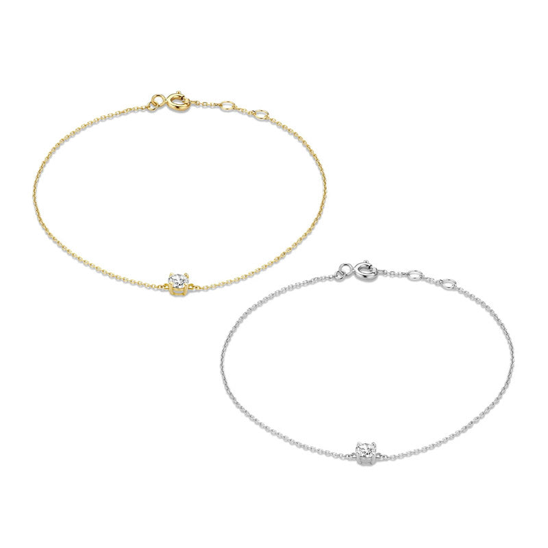 A set of 925 sterling silver thin chain bracelets, one in a gold finish and one in a silver finish, each featuring a single sparkling cubic zirconia stone.