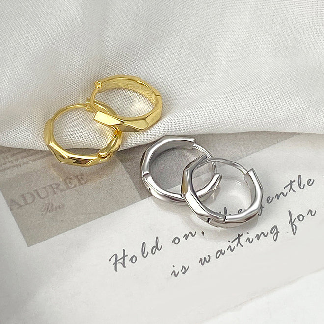 A product shot of 925 sterling silver octagon huggie hoop earrings, showing both the silver and gold color options on a clean white background.