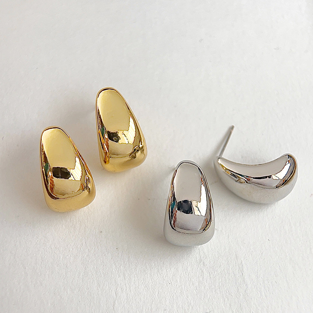 A product shot of chunky waterdrop stud earrings, displaying both the gold and silver plated options on a clean white background.