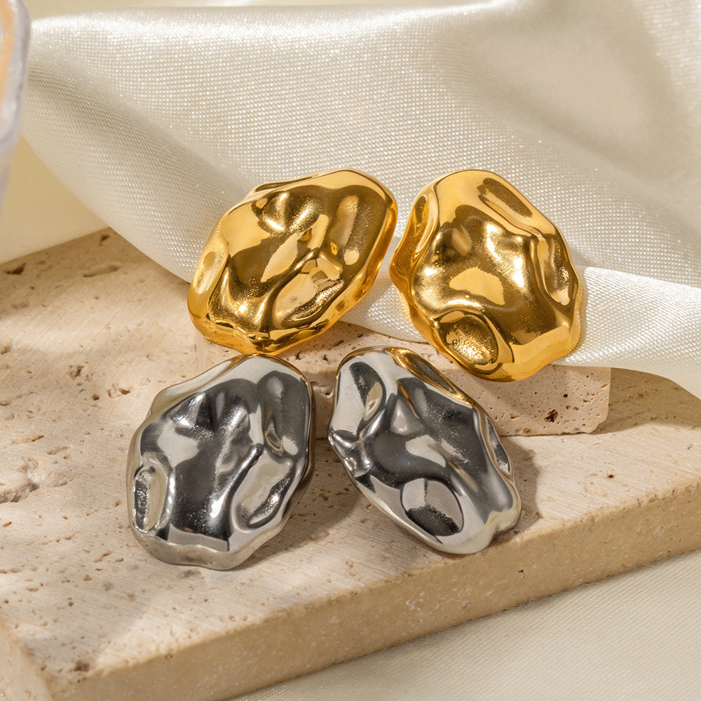 A set of stainless steel hammered irregular stud earrings, showcasing both the polished gold and silver finishes.