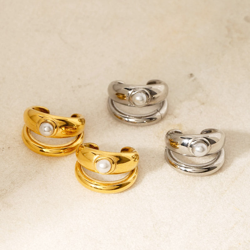 A set of minimalist double-layer pearl inlay ear cuff clip earrings, showcasing both the elegant gold and classic silver stainless steel variants.