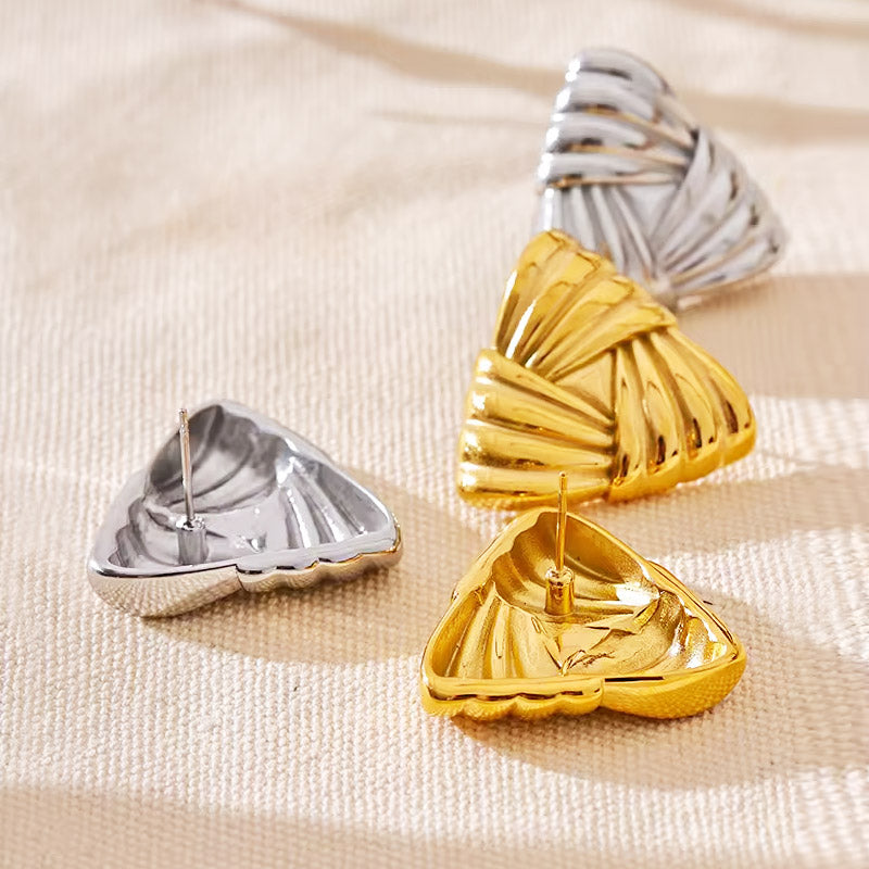 A pair of gold and a pair of silver stainless steel chunky weave triangle earrings displayed on a neutral background, highlighting their intricate texture and geometric shape.