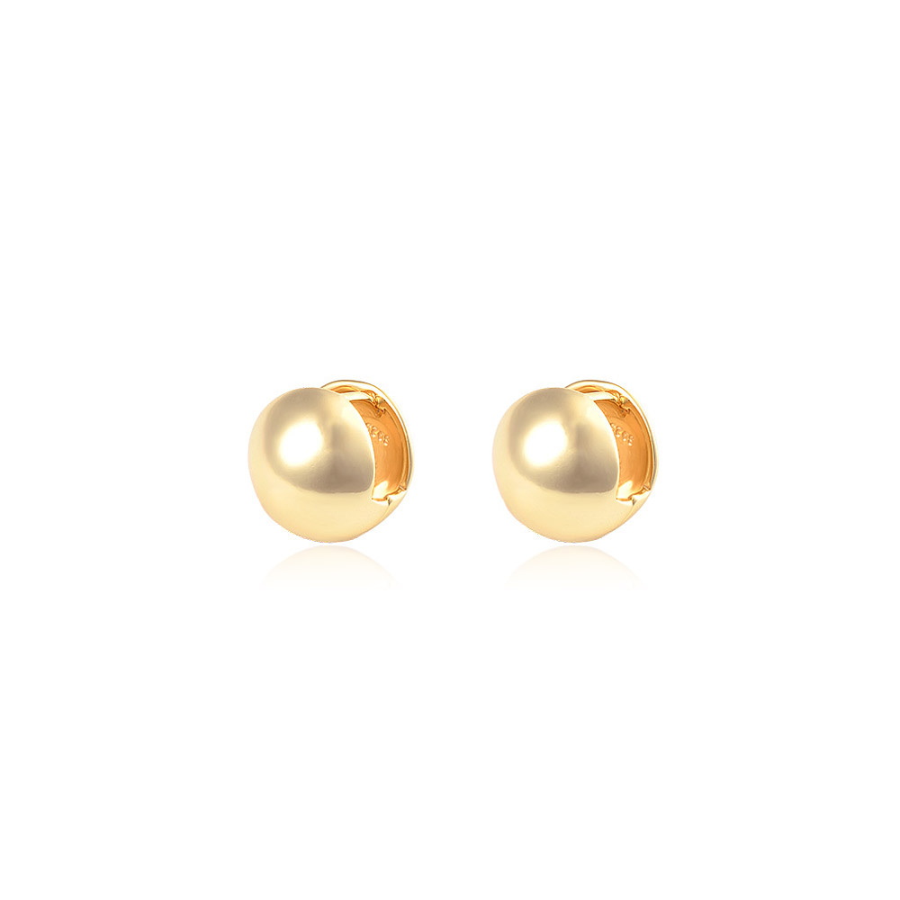 A pair of gold round hoop huggie earrings with a smooth, polished finish, displayed against a clean white background.