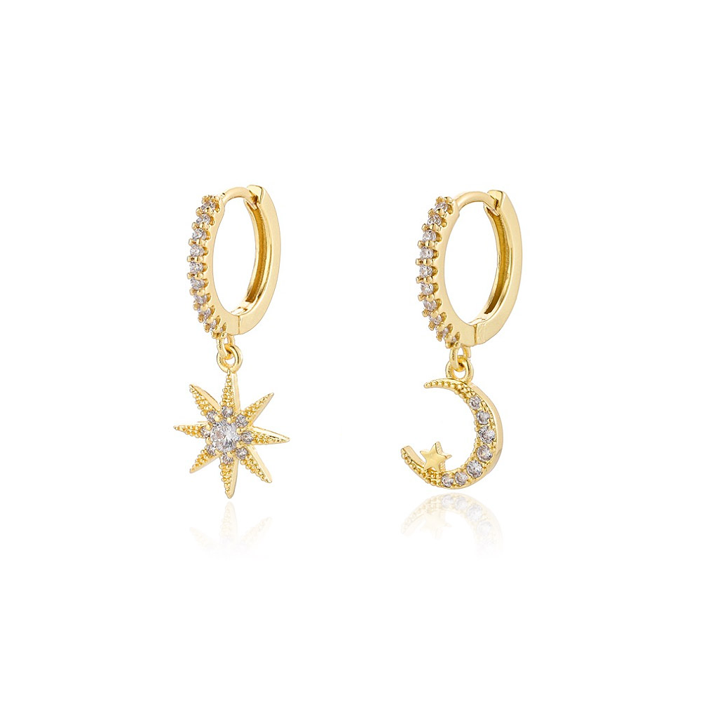 A pair of gorgeous star and moon huggie hoop earrings in 14k gold plating with sparkling cubic zirconia gemstones.