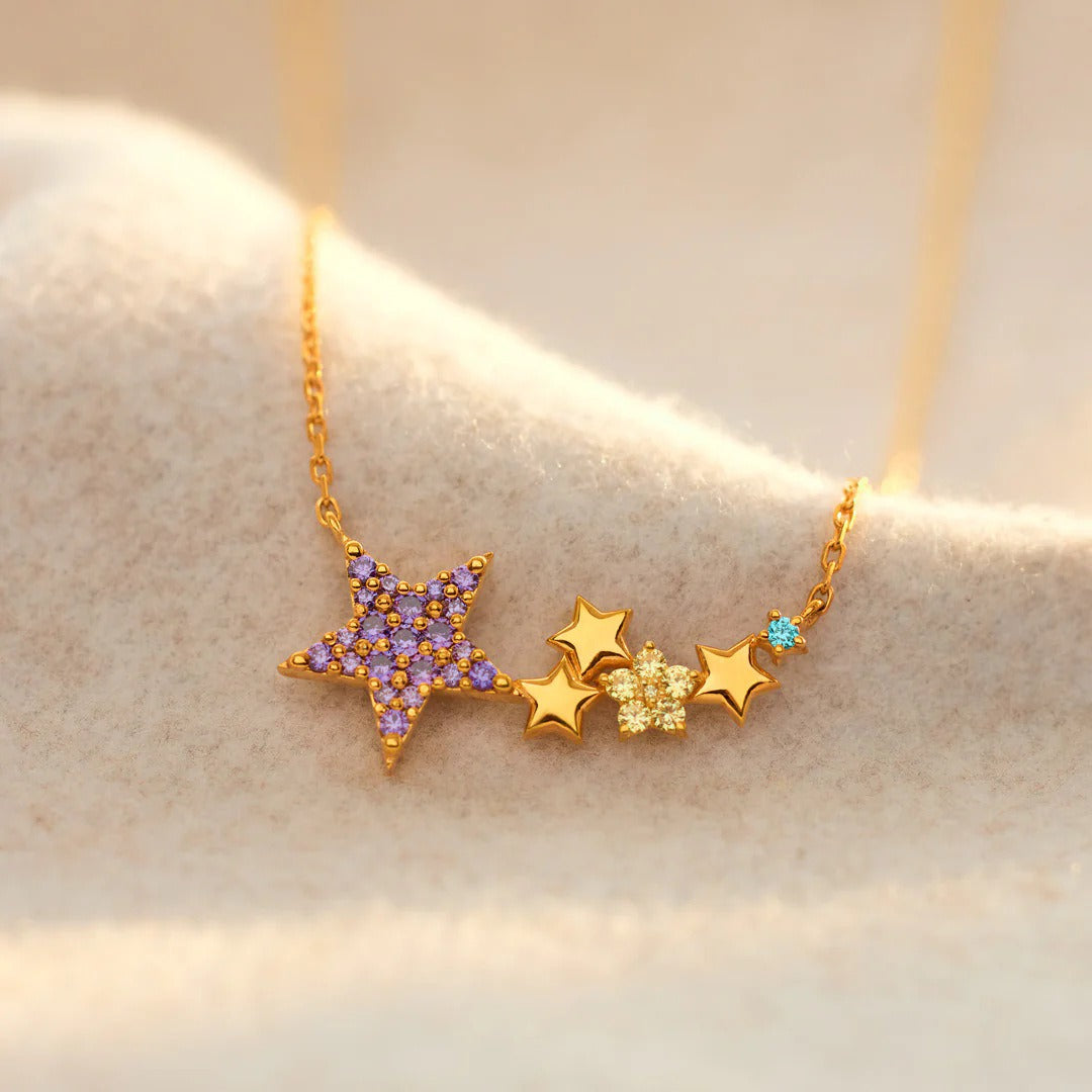 Close-up of a 925 sterling silver colorful star pendant necklace with purple, clear, and blue gemstones.