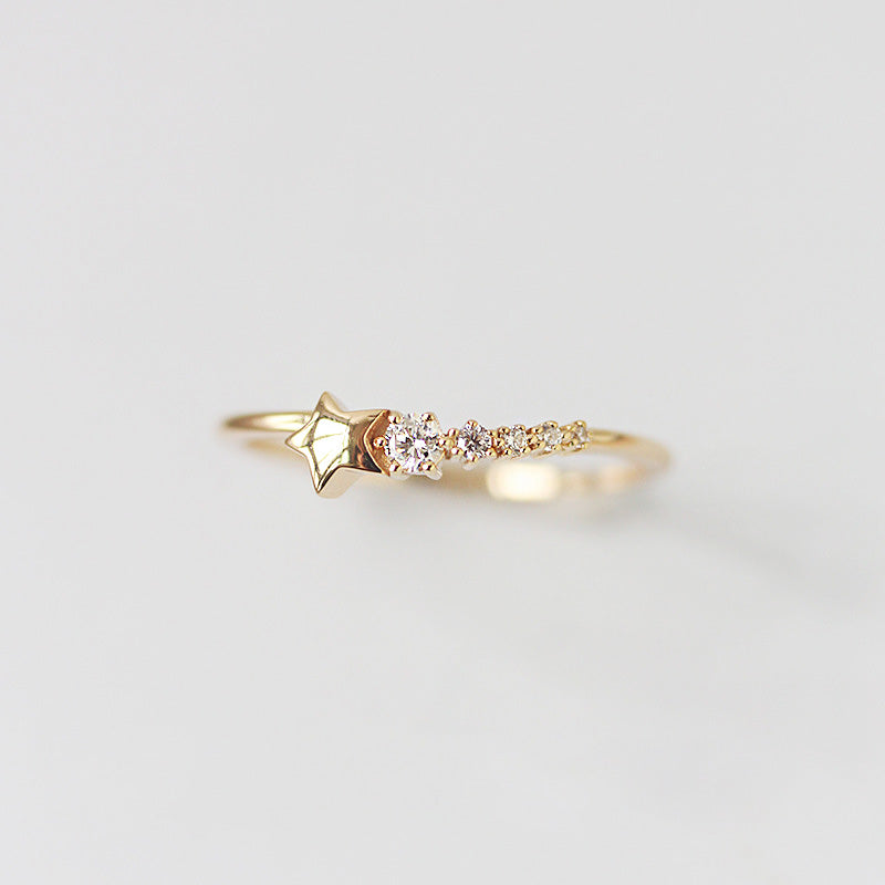 A detailed product shot of a gold 925 sterling silver star ring featuring intricate pavé crystal embellishments.