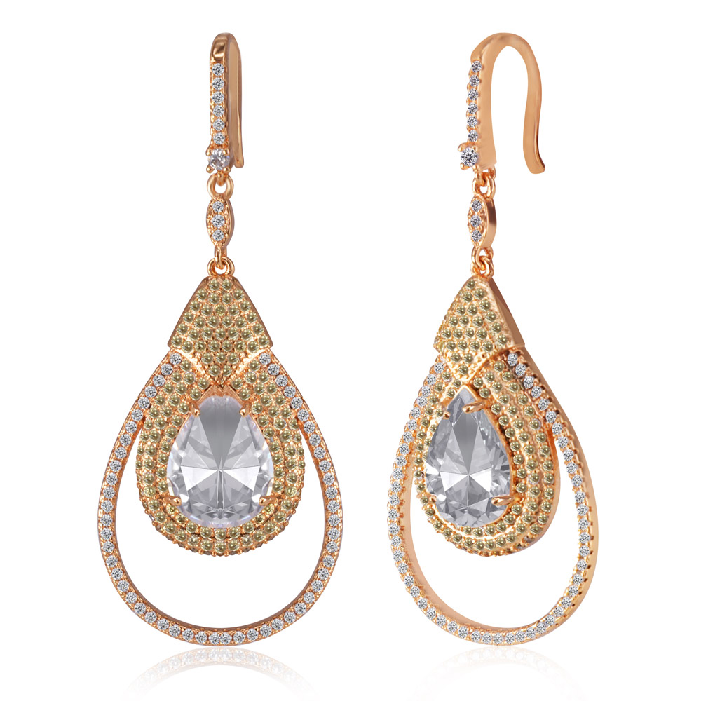 A pair of Magnificent Drops chandelier earrings in gold plating, featuring a teardrop design with sparkling clear and jonquil cubic zirconia stones.
