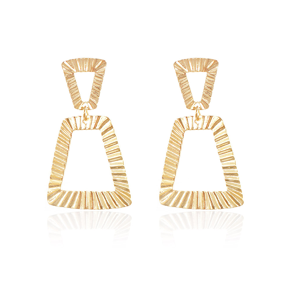 A pair of large geometric shaped earrings in gold plating, featuring a textured triangular design, shown against a white background.