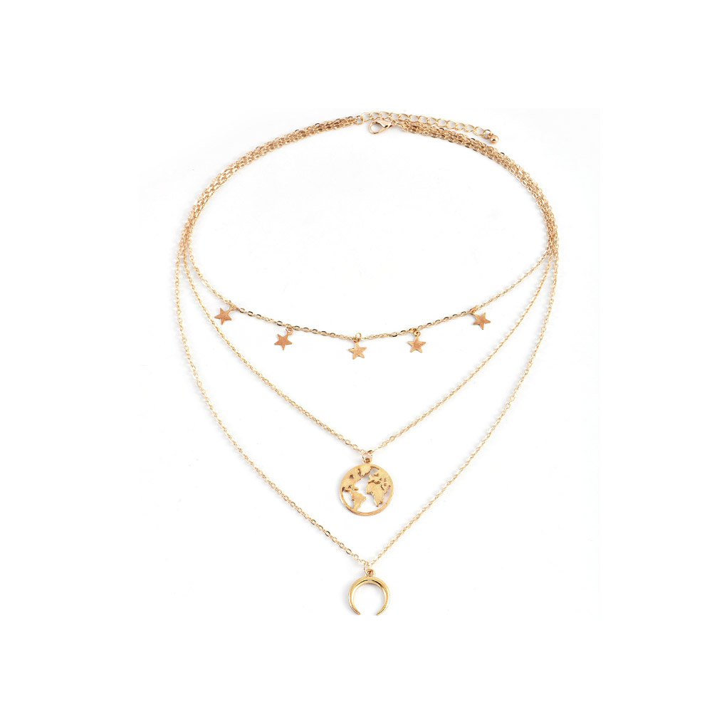 A gold-toned, triple-layered necklace featuring star, world map, and crescent moon pendants, showcasing its delicate and stylish design.