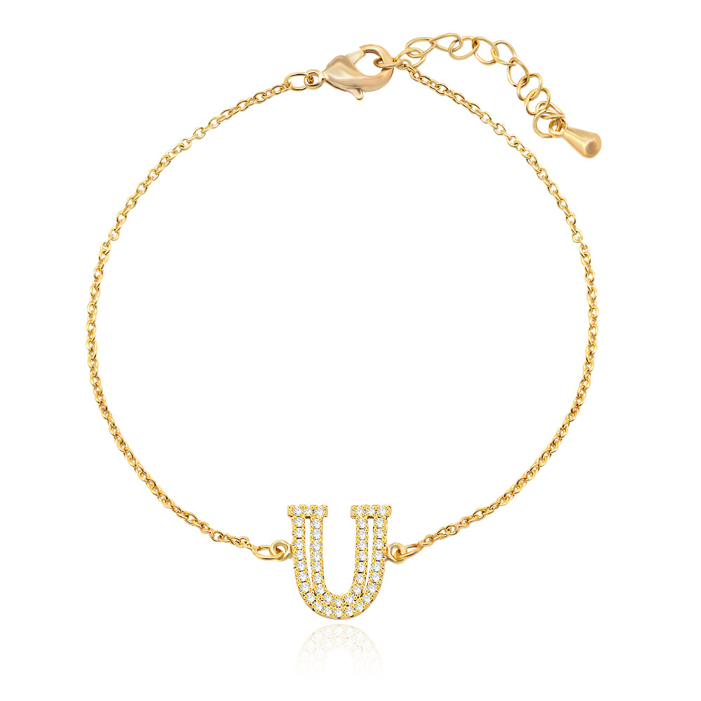 Close-up of the Diamond Alphabet Initial Bracelet in gold, showcasing the U-shaped charm set with brilliant cubic zirconia stones.