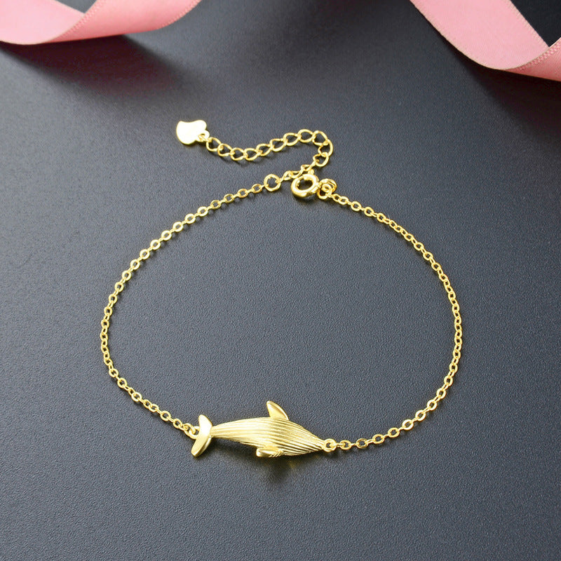 A close-up of the 925 sterling silver gold whale charm bracelet, showcasing the detailed whale pendant on a delicate chain.