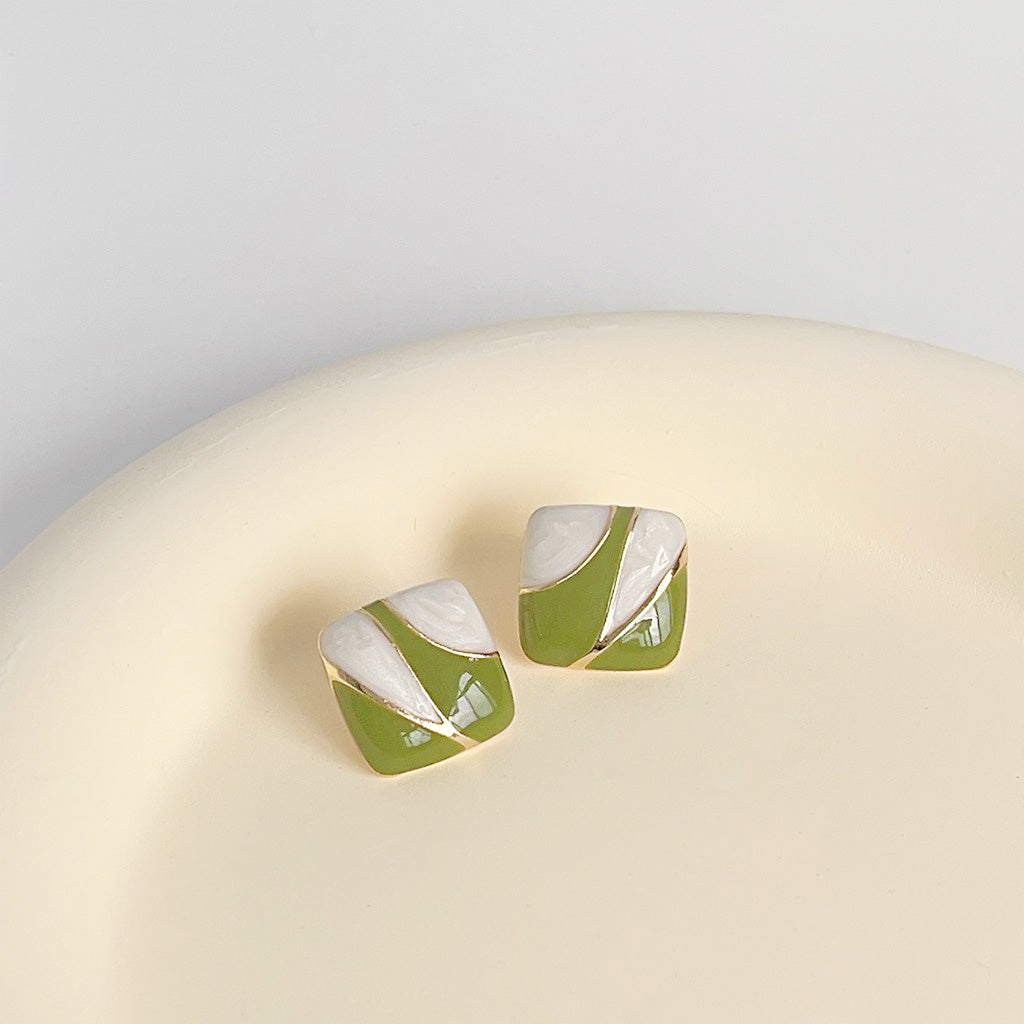 A set of 5 pairs of 14k gold-plated square stud earrings with a striking green and white enamel pattern.