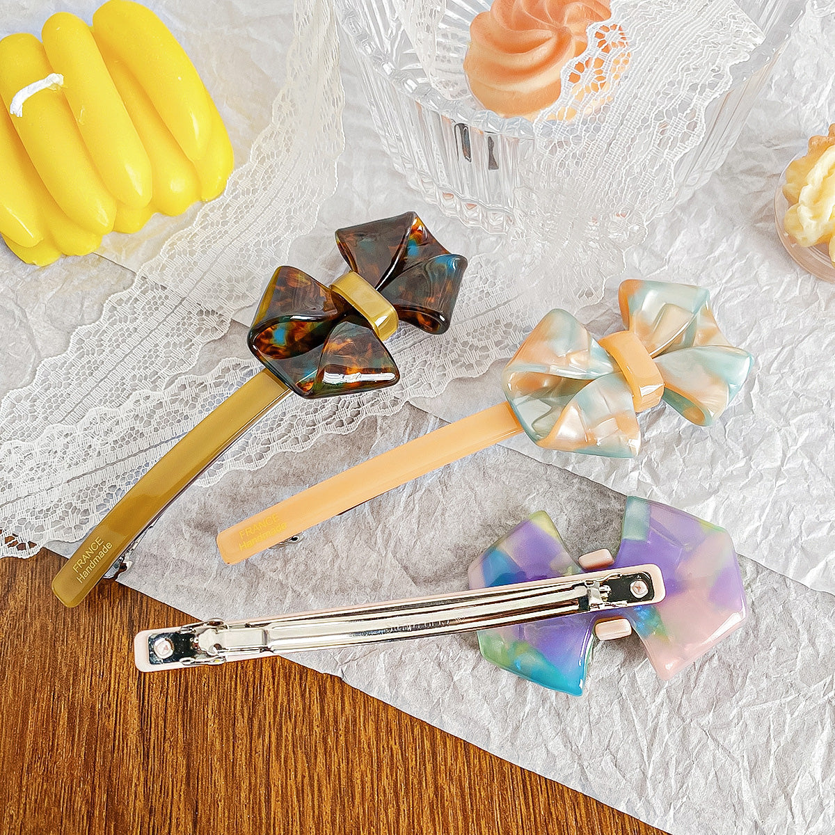 A collection of colorful acetate bow knot barrette hair clips, showcasing various designs and patterns available in the set.