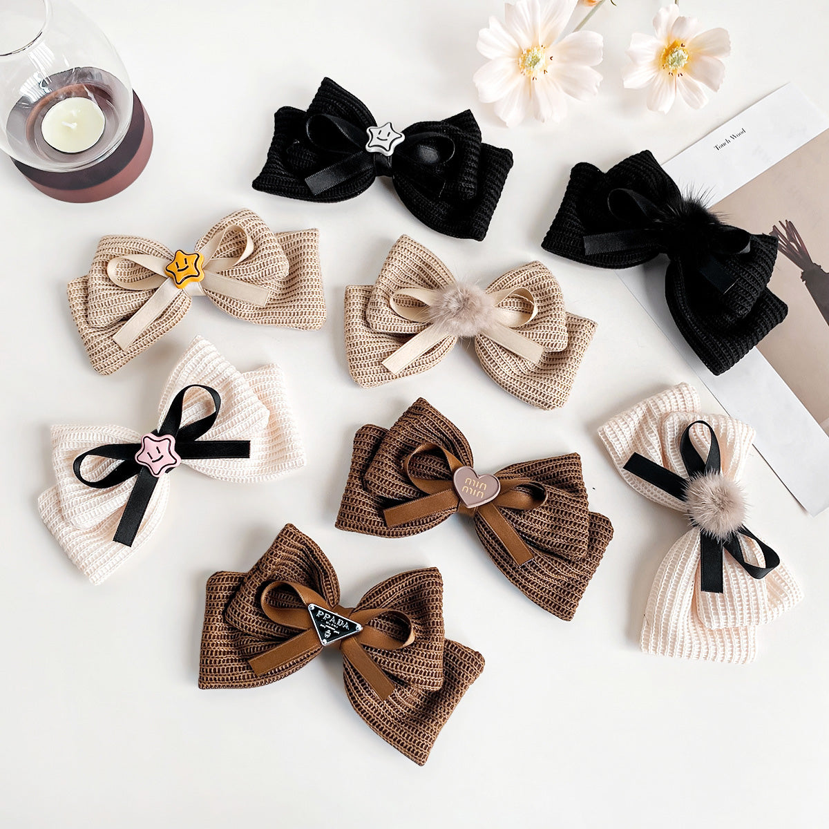 A collection of French retro style knitted bowknot alligator hair clips in various colors and designs, including white, brown, and black with star and pom-pom details.
