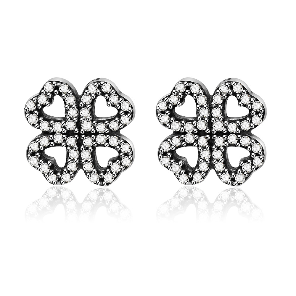 A pair of silver stud hydrangea earrings with heart-shaped cutouts and sparkling cubic zirconia stones, presented on a white background.