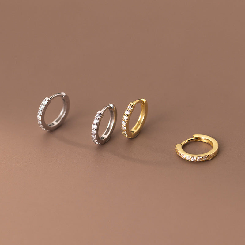 A promotional showcase of 925 sterling silver simple geometric zircon huggies hoop earrings, displaying both silver and gold color options.