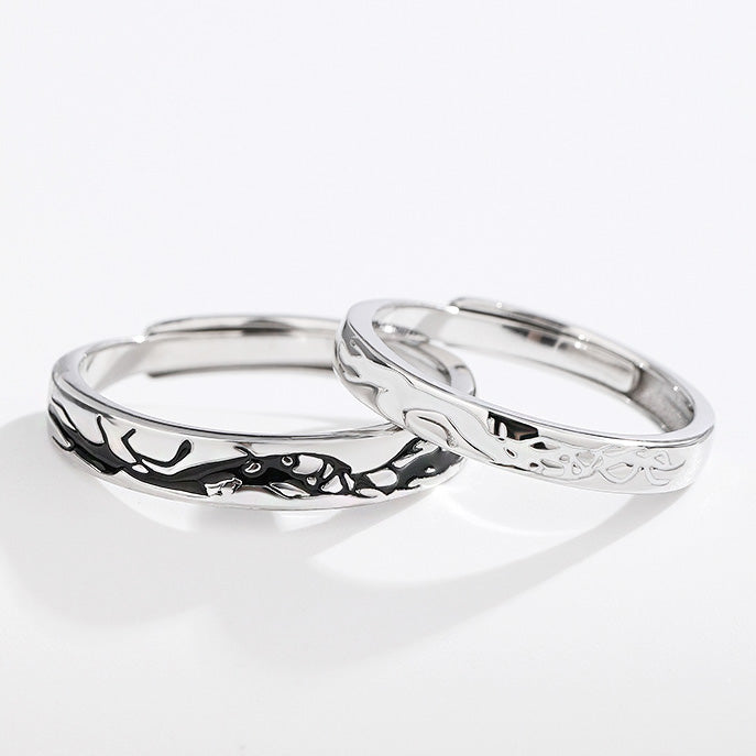 A pair of 925 sterling silver matching couple rings with a beautiful interconnected design, symbolizing love and unity.