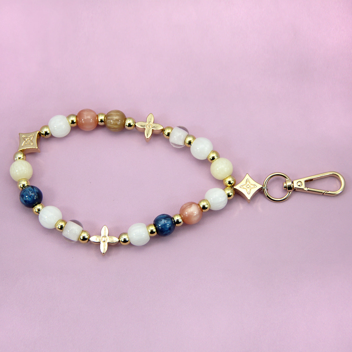 A vibrant multicolor beaded phone charm and bracelet strap made from acrylic, featuring gold-tone accents and a secure clasp, available for bulk wholesale.
