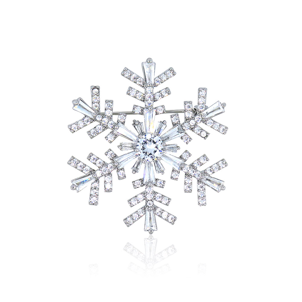 A luxurious snowflake-shaped brooch made of rhodium-plated brass, adorned with sparkling AAA-grade cubic zirconia crystals, shown against a white background.