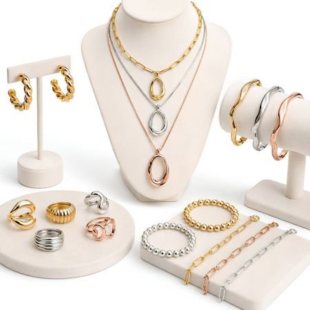 B2B custom brass jewelry manufacturer. Wholesale statement necklaces, wavy bangles, and chunky rings in mixed metal plating.