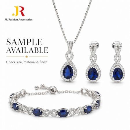 B2B custom jewelry sample available to check size, material, and finish. Silver necklace set featuring blue stones.