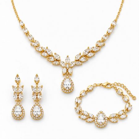 Wholesale gold cubic zirconia bridal jewelry set with teardrop necklace, earrings, and bracelet for B2B buyers.